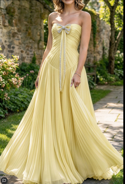 Strapless Pleated Evening Gown with Bow Accent