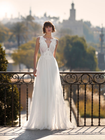 Pleated tulle wedding dress with appliques