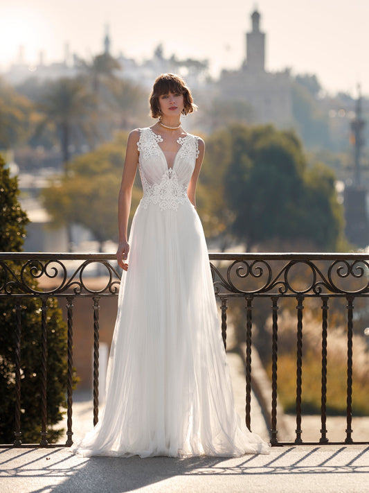 Pleated tulle wedding dress with appliques