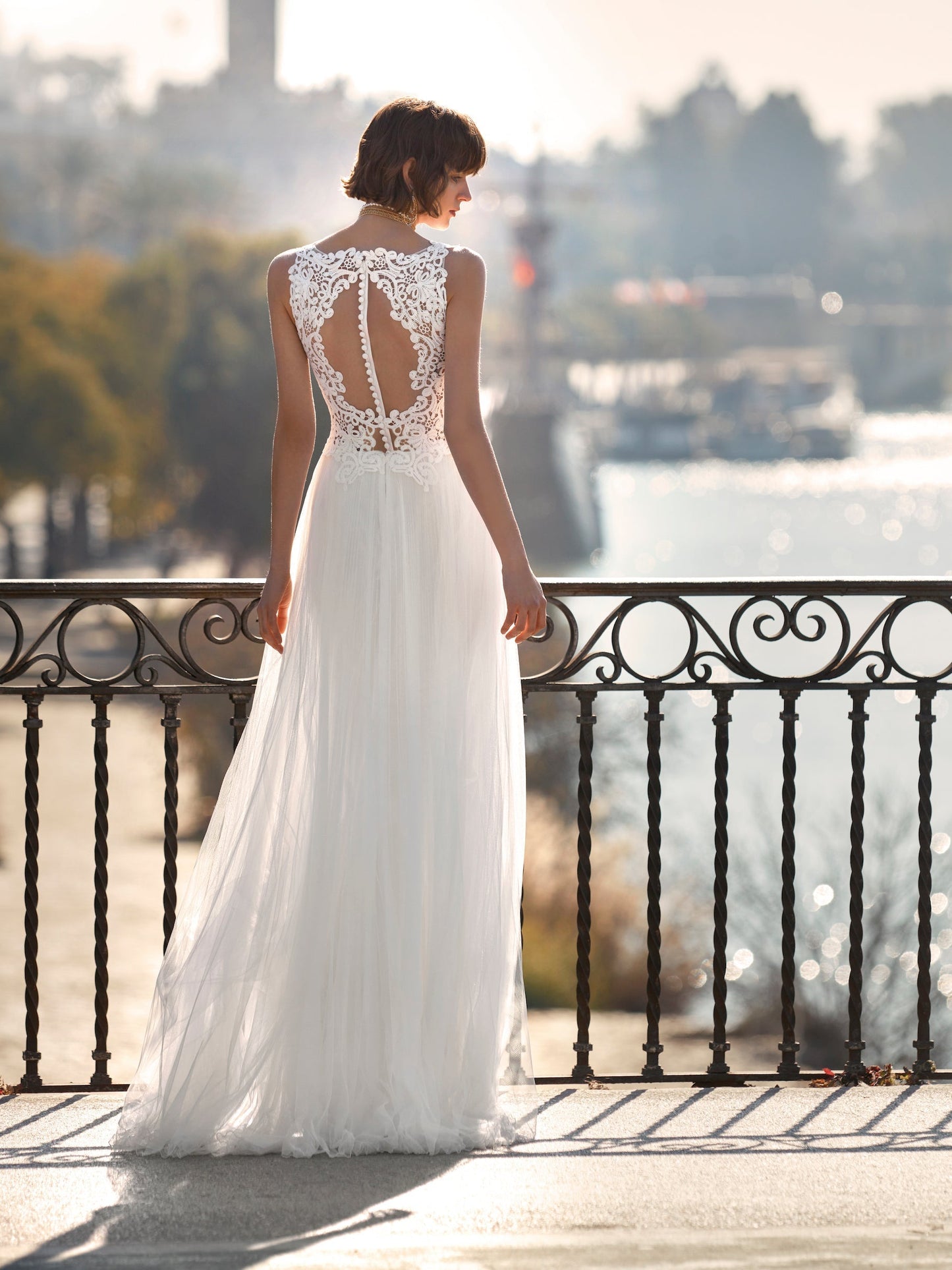Pleated tulle wedding dress with appliques