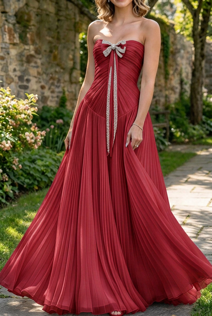 Strapless Pleated Evening Gown with Bow Accent