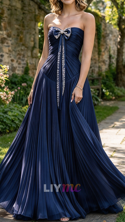 Strapless Pleated Evening Gown with Bow Accent