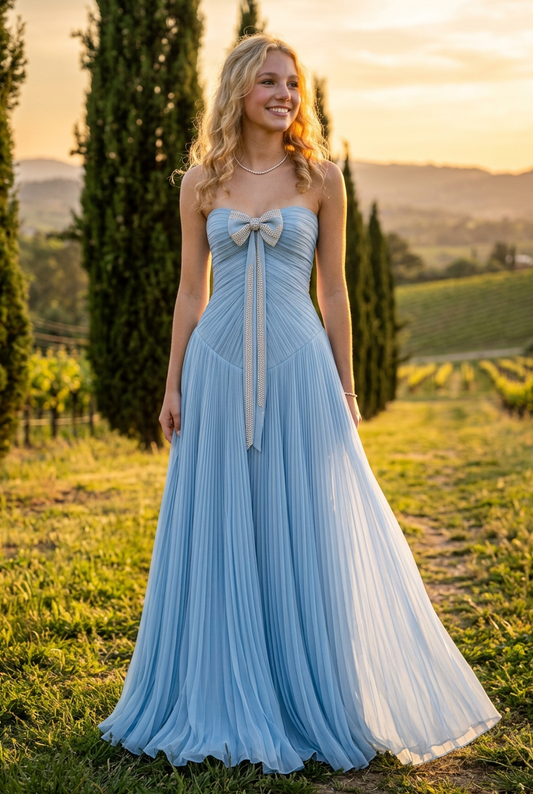 Strapless Pleated Evening Gown with Bow Accent