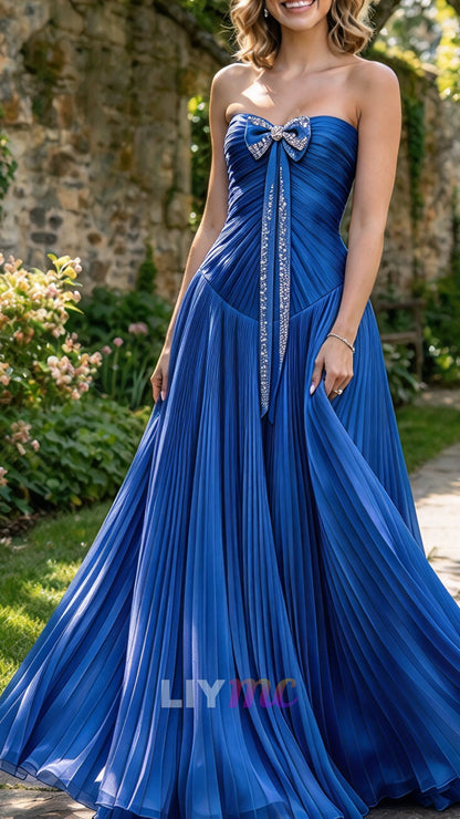 Strapless Pleated Evening Gown with Bow Accent